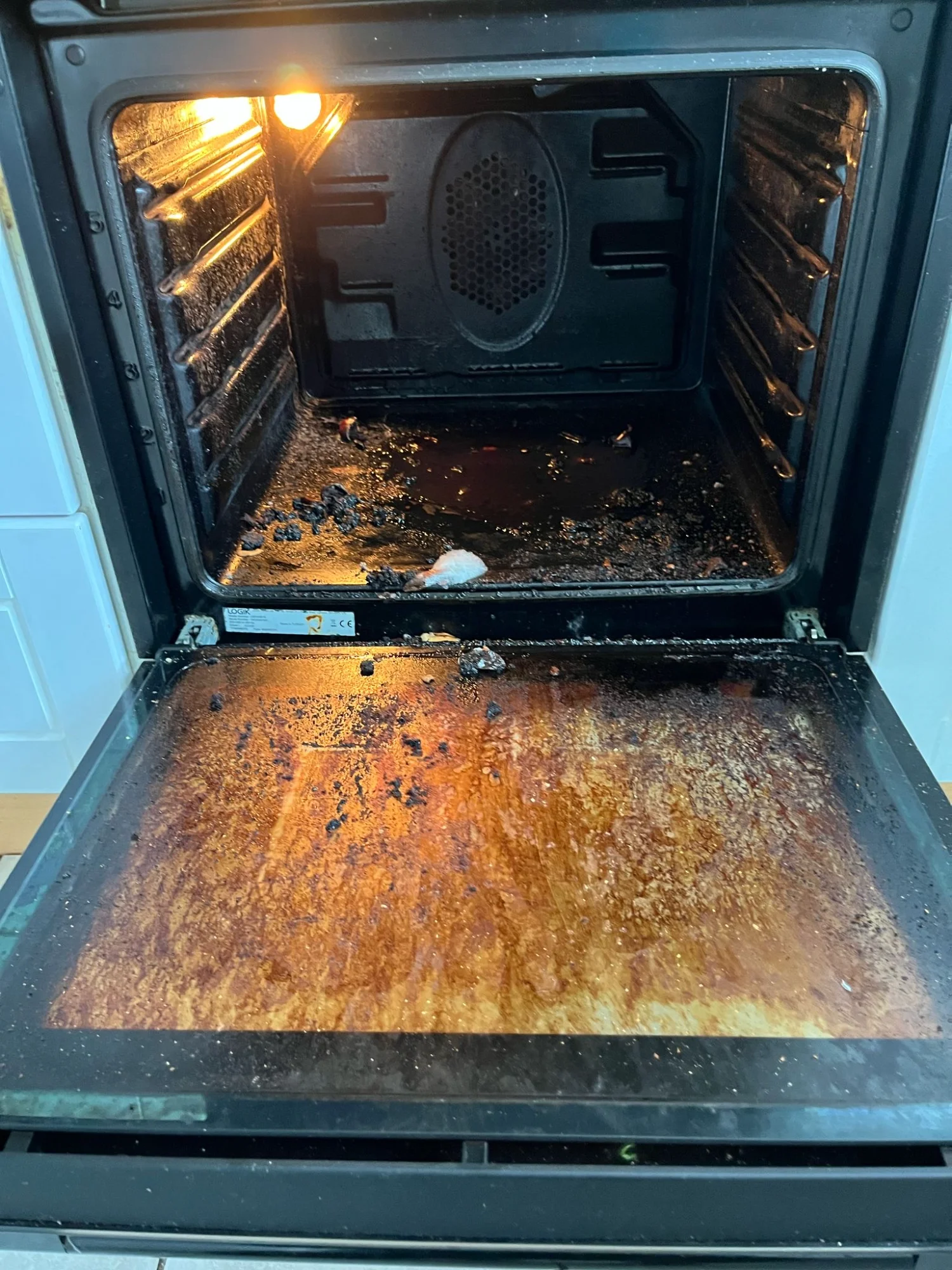 Oven with burnt-on grease before cleaning