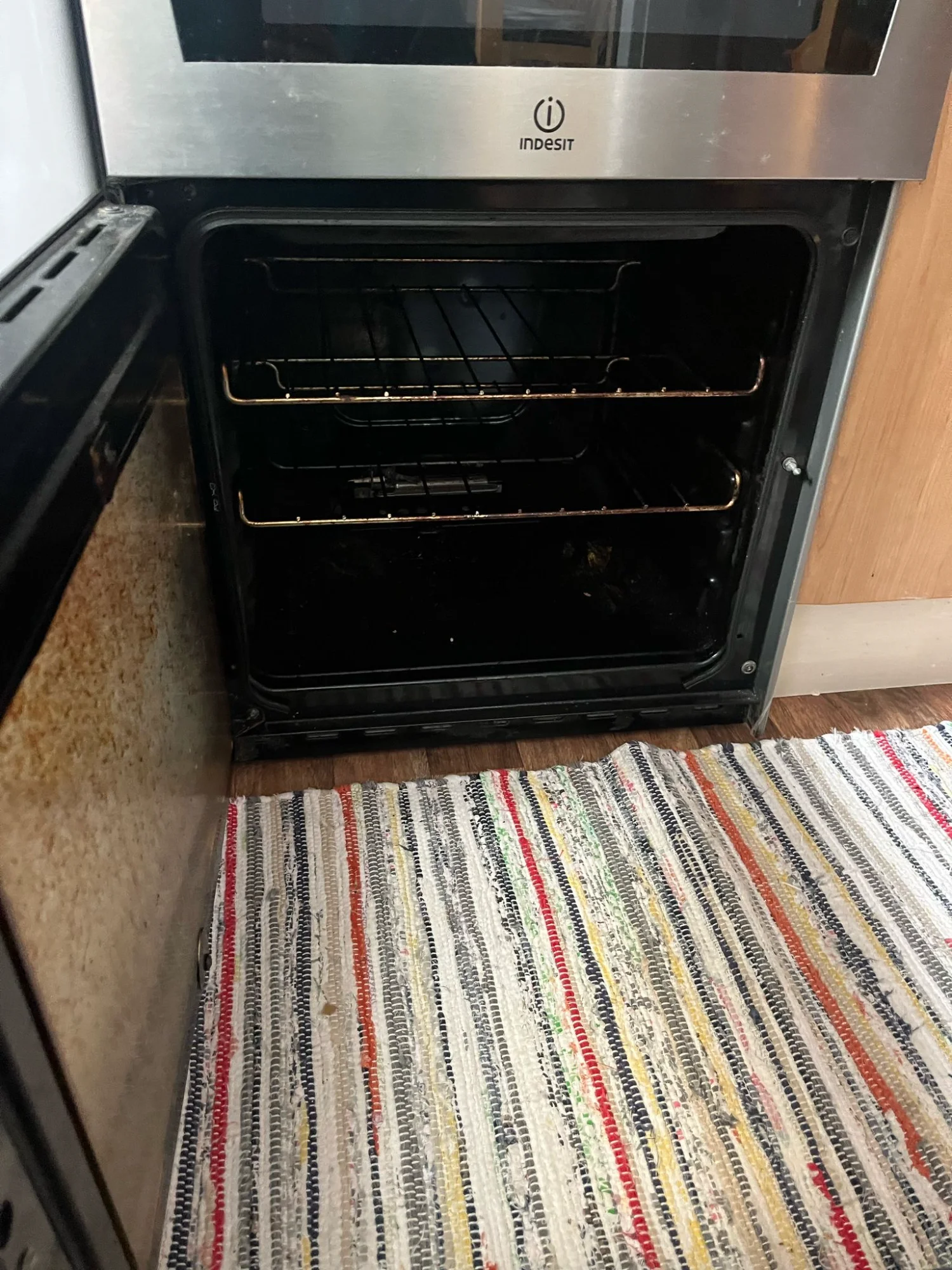 Grease-covered oven before cleaning service