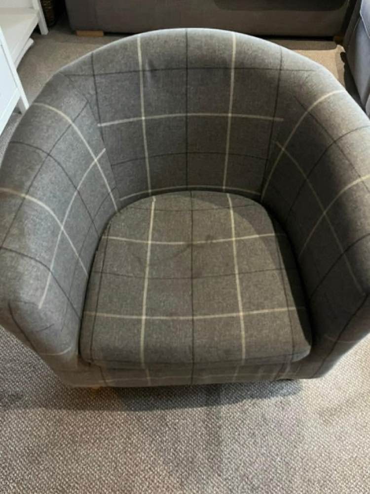 Grey check tub chair before professional upholstery cleaning — Teesside